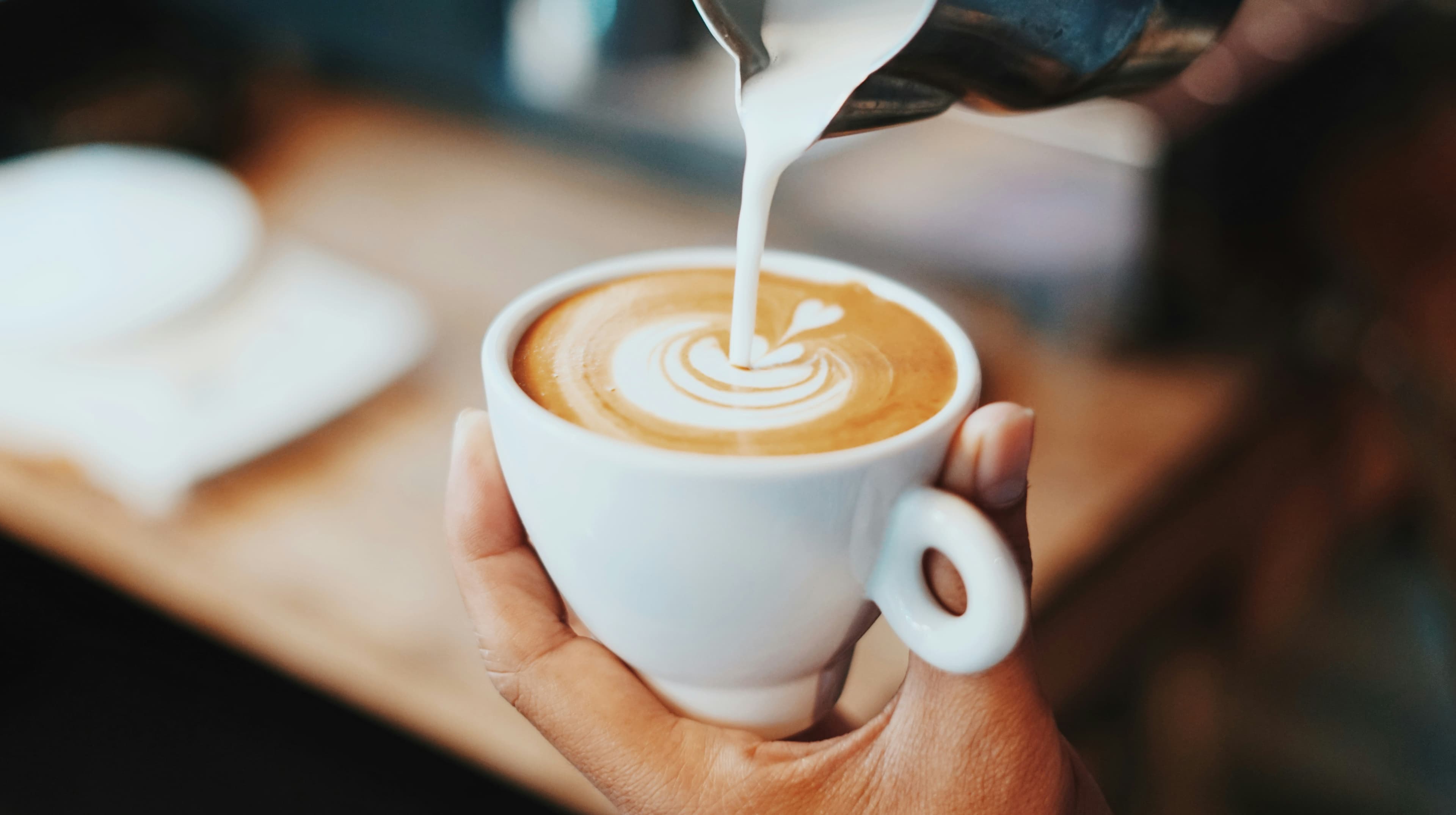Specialty coffee latte art being crafted
